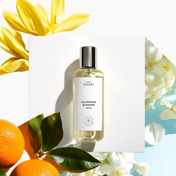 Perfume bottle labeled 'California Blossom' with flowers and oranges on a white background