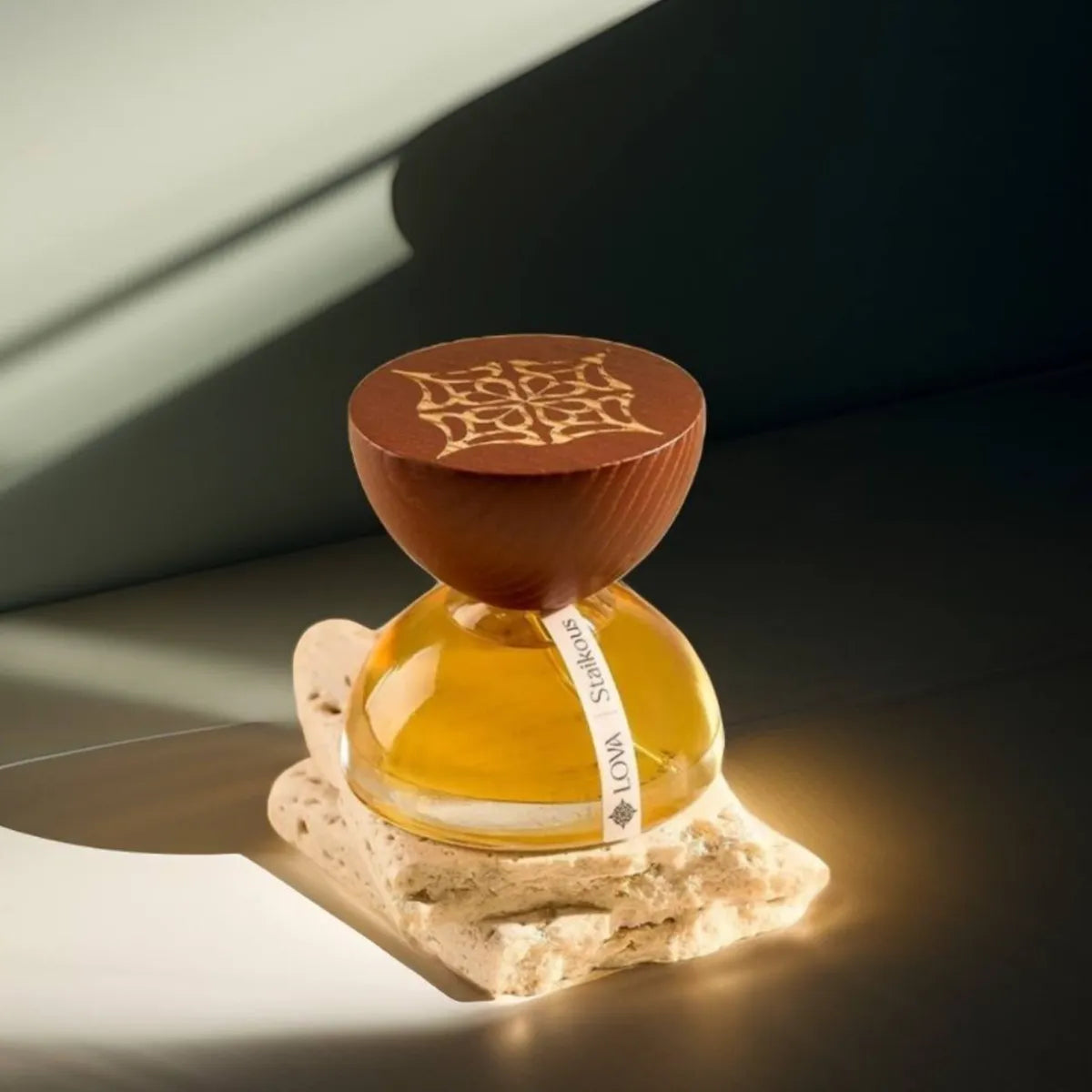 Decorative bottle with wooden cap on a textured surface